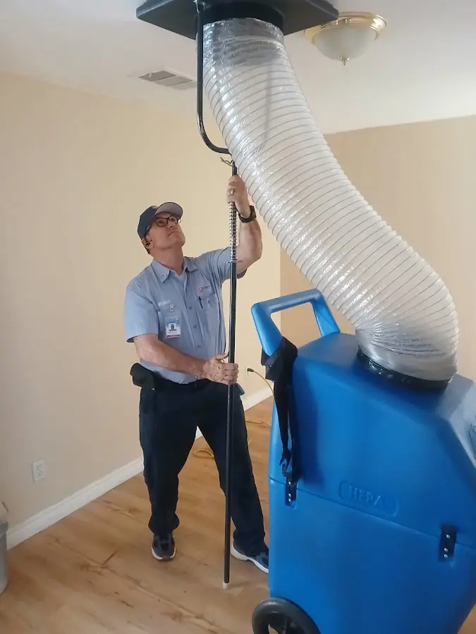 Furnace Tune-Up technician using HEPA equipment in Rancho Cordova